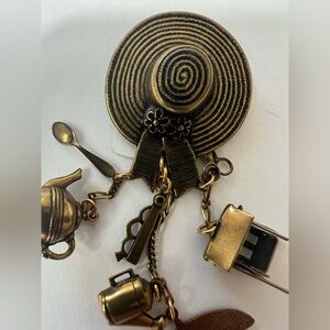 Charming Gold Brooch with Charms